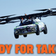 A photo of a flying car prototype with the caption "ready for takeoff".